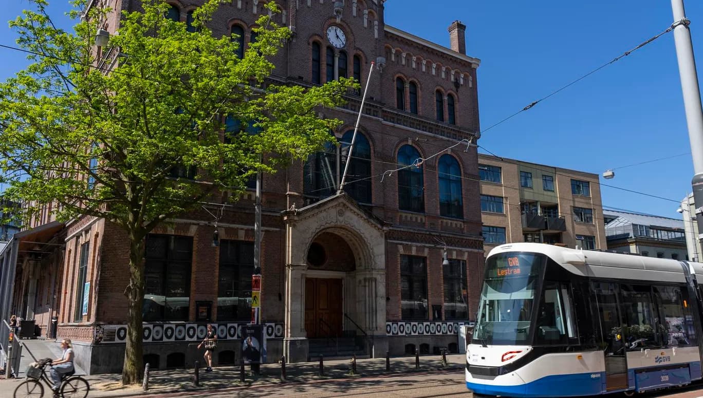 A tram passing music venue Paradiso at Weteringschans near Leidseplein.