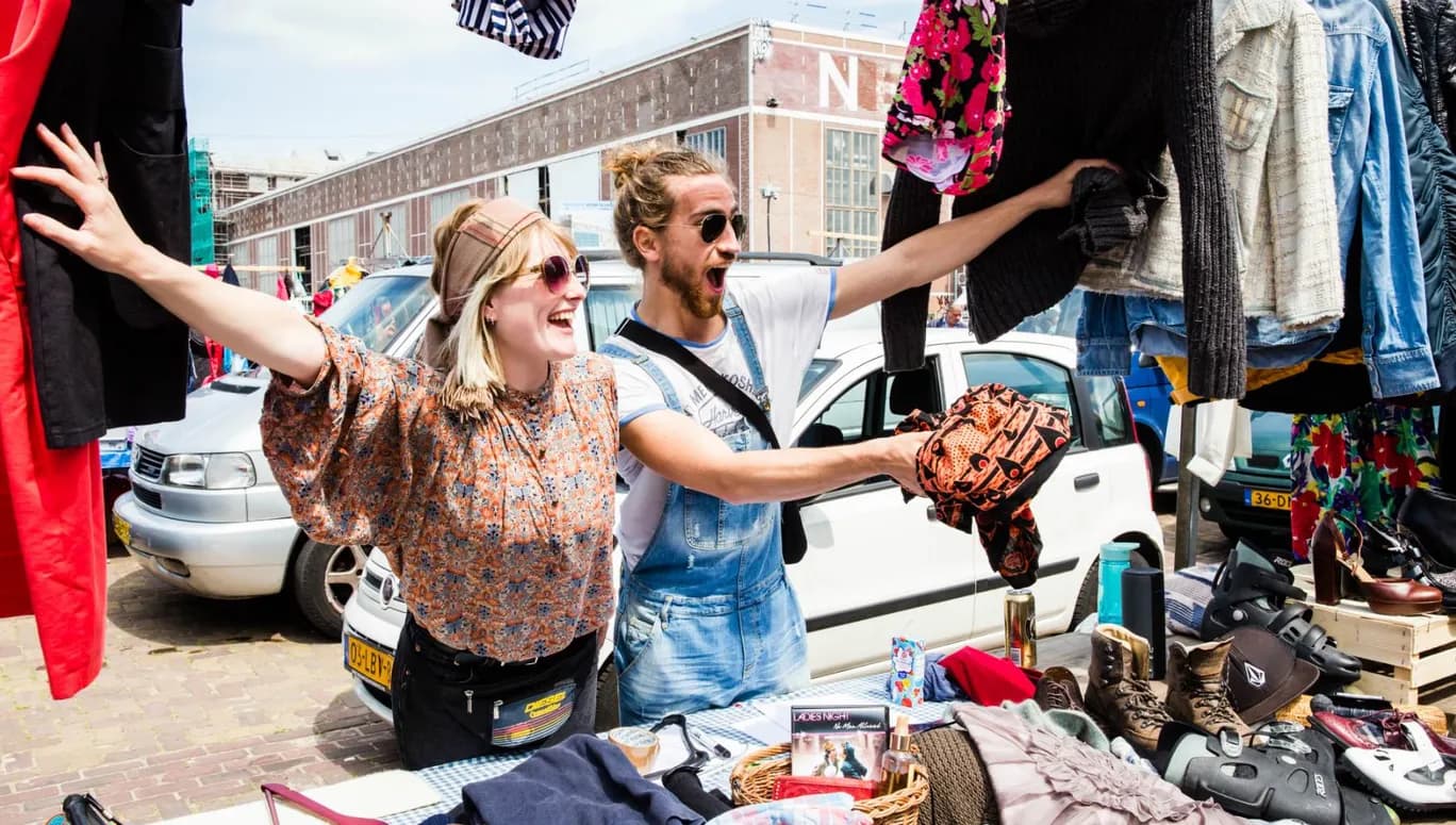 Man and woman selling clothes at IJhallen