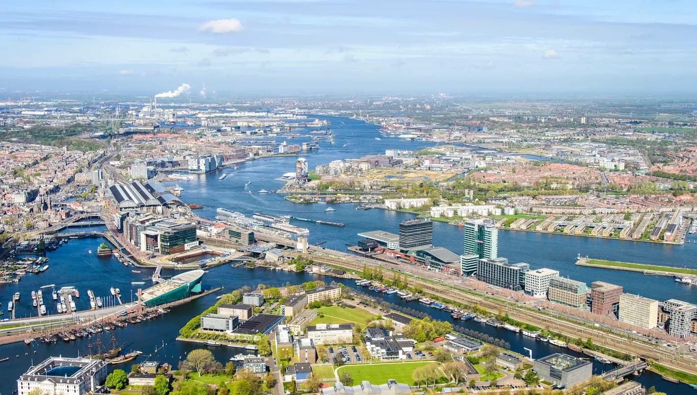 Nederland, Noord-Holland, Amsterdam, 09-04-2014;
Overzicht Marineterrein en omgeving, linksbeneden het Scheepvaartmuseum, Kattenburg, de IJtunnel en museum Nemo, verder Oosterdokseiland,  Centraal Station. Boven in beeld het IJ, Amsterdam West en Noord.
View on Navy area (center) and the National Maritime Museum (white building), left Museum Nemo, central station, newly constructed buildings. Top right the North of Amsterdam. 
luchtfoto (toeslag op standard tarieven);
aerial photo (additional fee required);
copyright foto/photo Siebe Swart