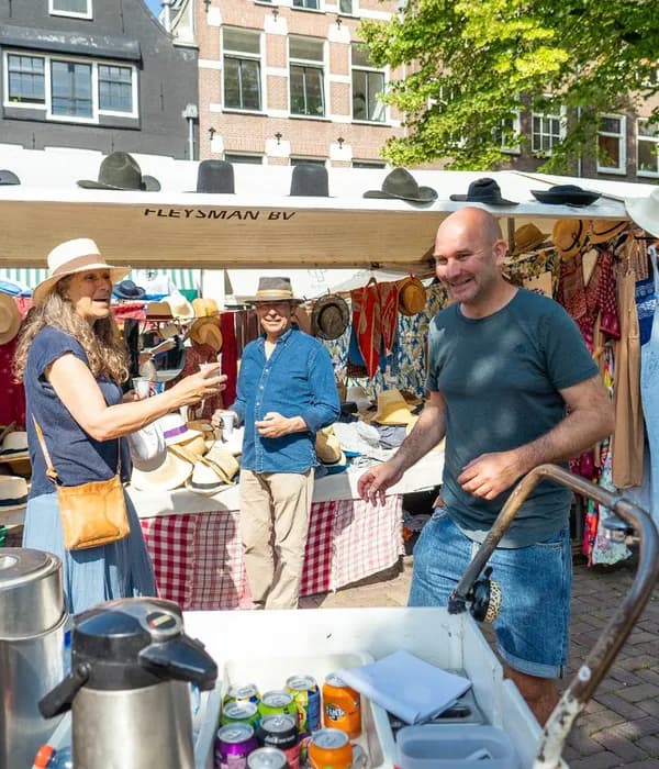 People laughing while shopping at Noordermarkt