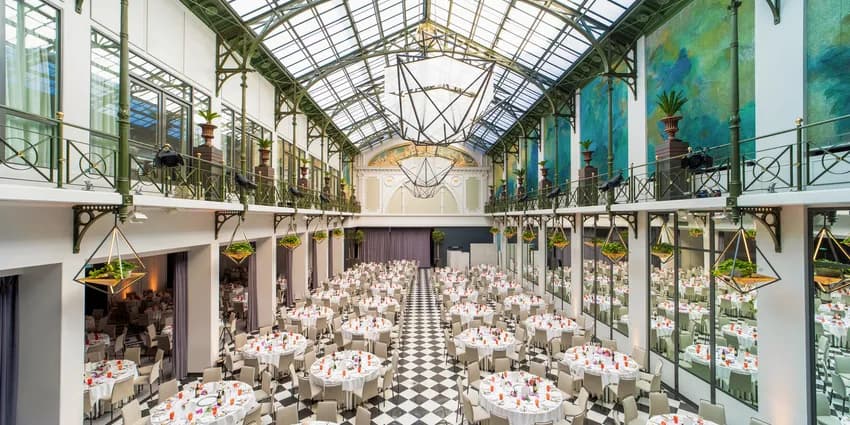 Wintergarden meeting room with banquet setting at Anantara Grand Hotel Krasnapolsky.
