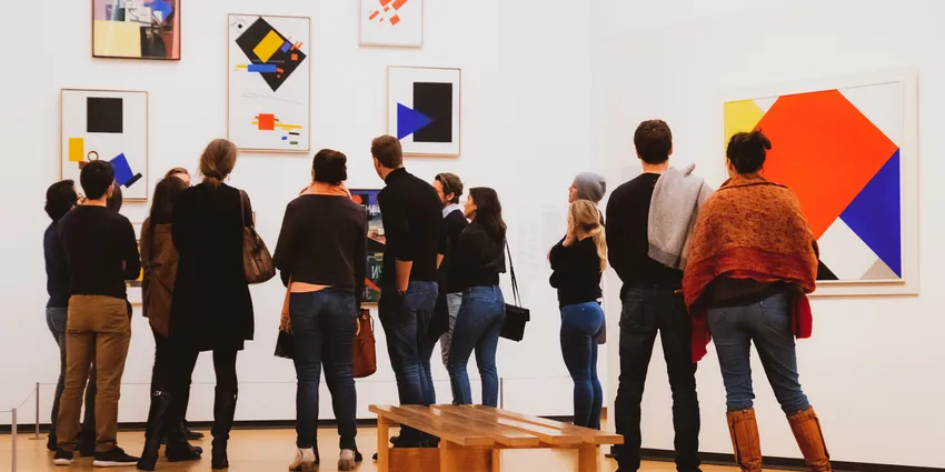 People looking at art in the Stedelijk Museum for Amsterdam Culture Club