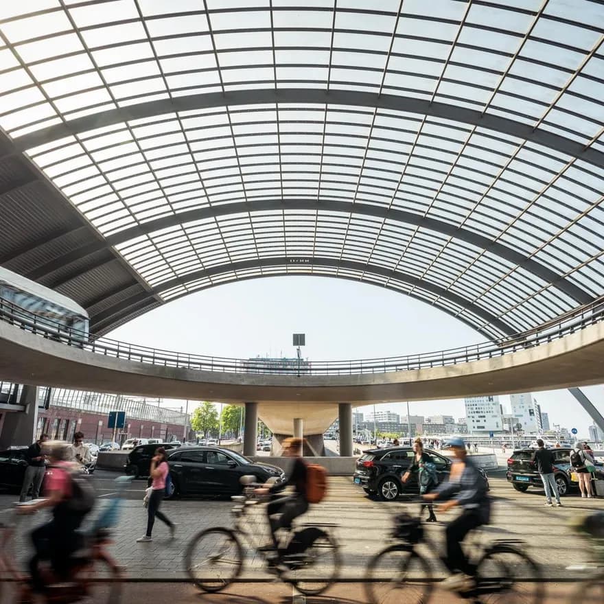 Cyclist at Amsterdam Centraal Station.