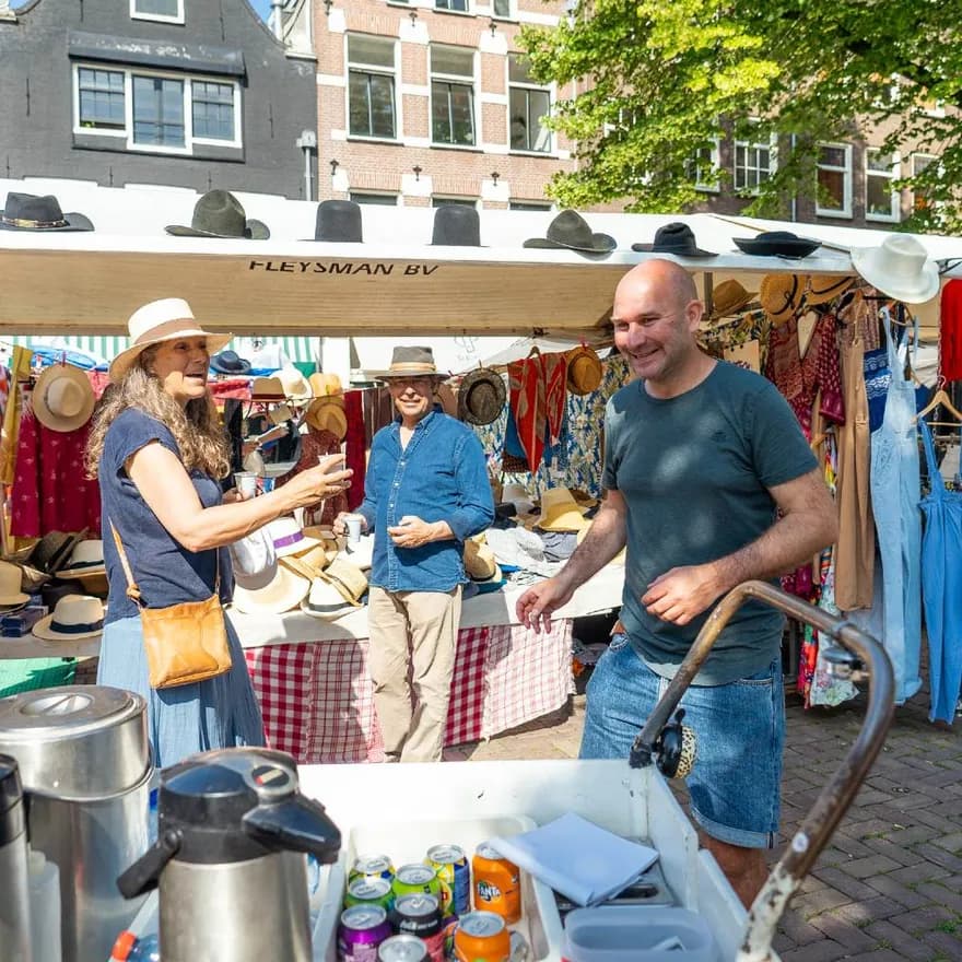 People laughing while shopping at Noordermarkt