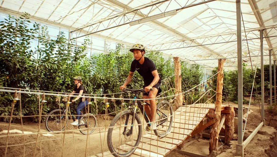 People practising indoor mountain biking