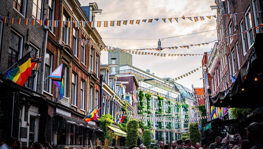 Rainbow flags hanging all over the Reguliersdwarsstraat.