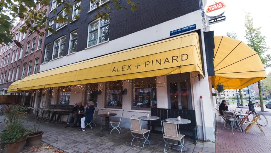 People sitting outside Alex + Pinard terrace