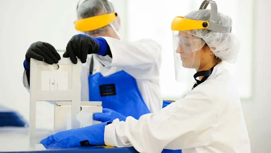 two scientists with equipment