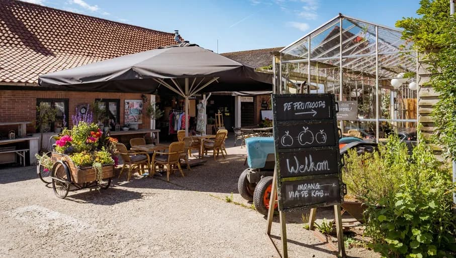 The terrace and the fruit shed of Landgoed de Olmenhorst in Lisserbroek