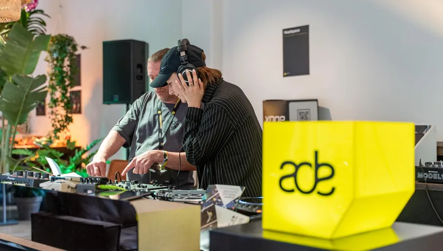 Man and woman DJ'ing in De Brakke Grond during Amsterdam Dance Event (ADE) 2022.