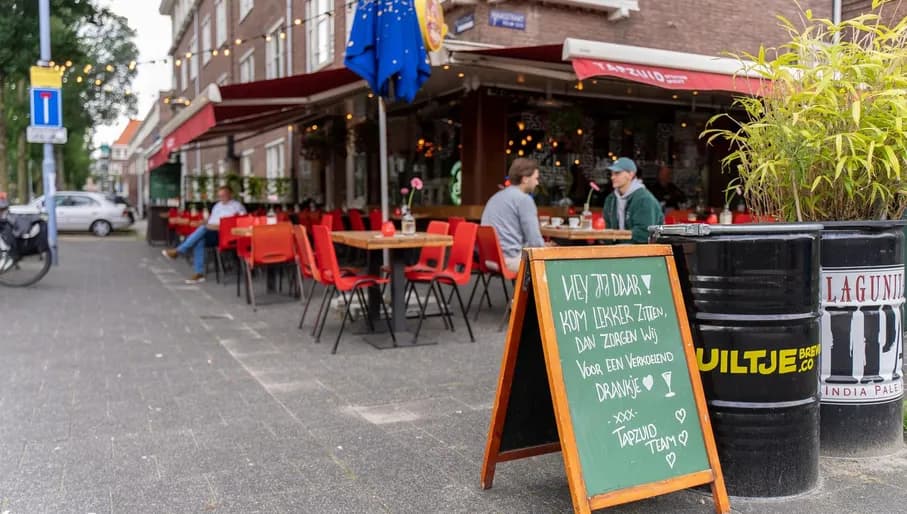 Tapzuid, Rivierenbuurt, people sitting at the terrace and sign outside