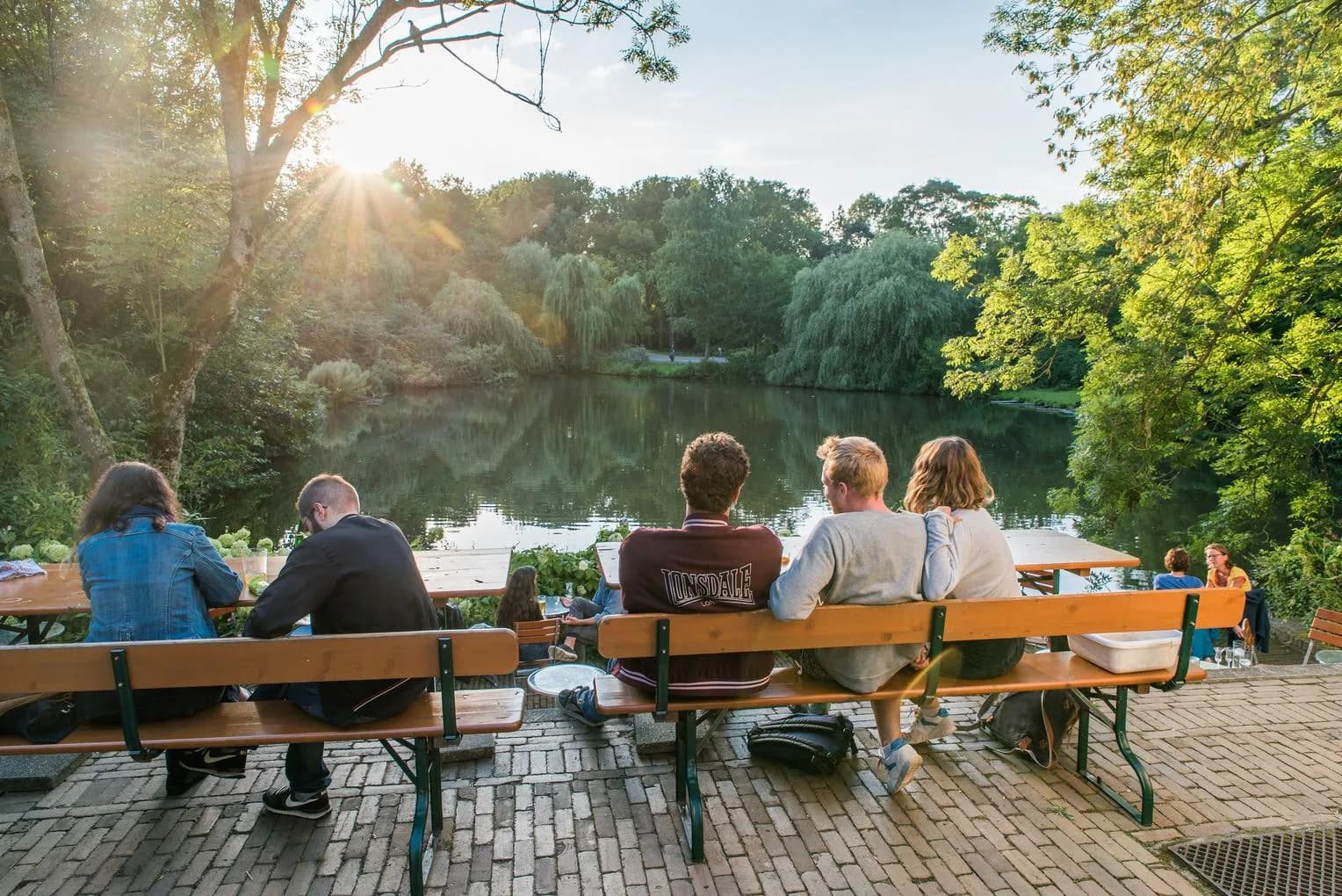 People sitting at terrace at 't Nieuwe Diep in Flevopark drinking jenever